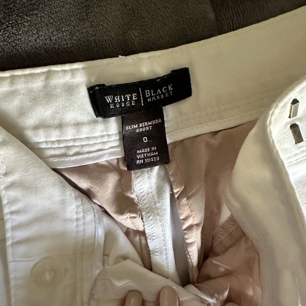 White shorts long gold buckle at pocket